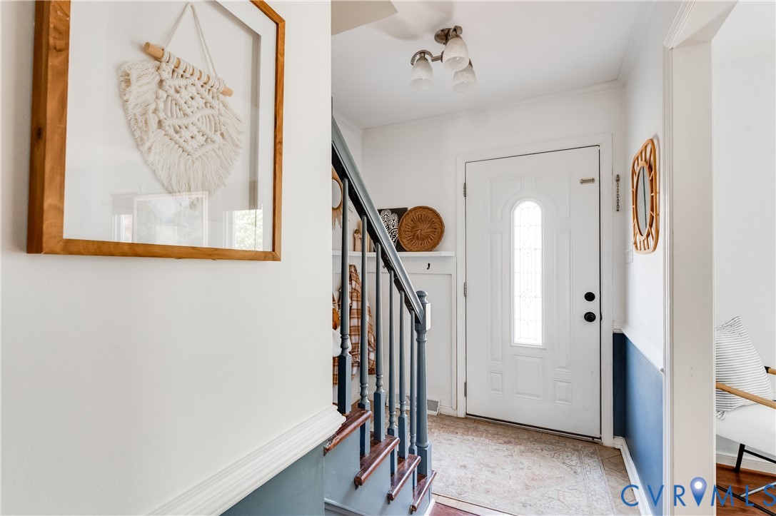 1318 Unison Drive Midlothian, VA 23113 - Photo 8 of 47 a view of a hallway with entryway and chandelier