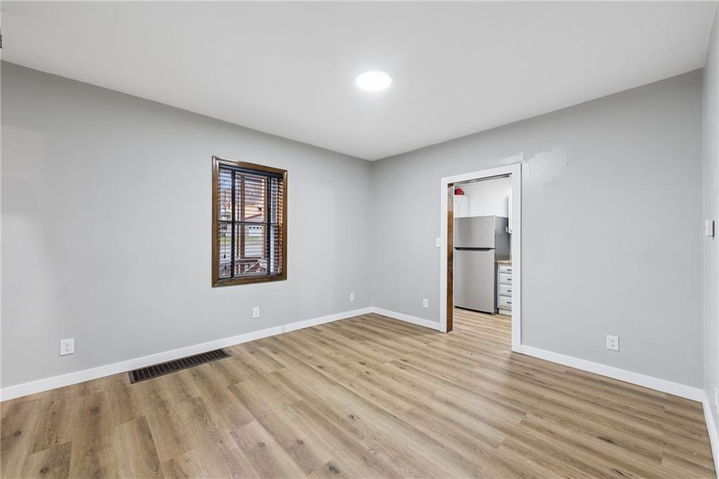 330 Braeburn Road Lower Burrell, PA 15068 - Photo 12 of 31 a view of empty room with wooden floor and fan
