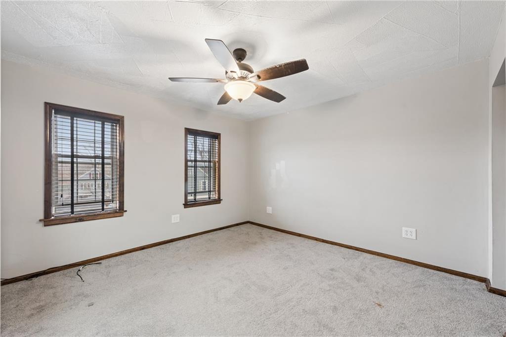 330 Braeburn Road Lower Burrell, PA 15068 - Photo 19 of 31 an empty room with windows and fan