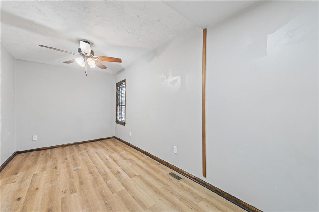 330 Braeburn Road Lower Burrell, PA 15068 - Photo 24 of 31 a view of room with a ceiling fan and wooden floor