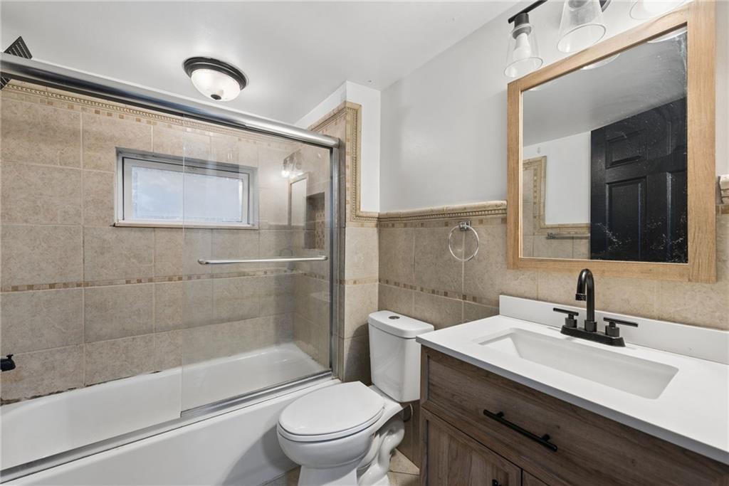 330 Braeburn Road Lower Burrell, PA 15068 - Photo 25 of 31 a bathroom with a sink a toilet and shower