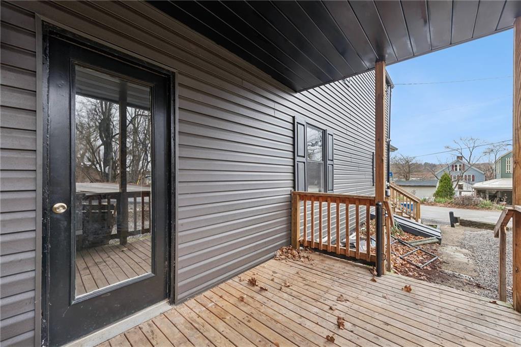 330 Braeburn Road Lower Burrell, PA 15068 - Photo 4 of 31 a view of a balcony with wooden floor