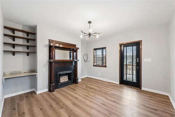 a bedroom with a bed and a fireplace