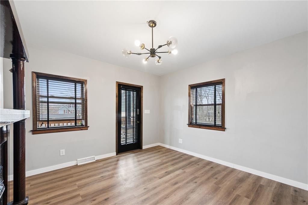 330 Braeburn Road Lower Burrell, PA 15068 - Photo 9 of 31 an empty room with windows and ceiling fan