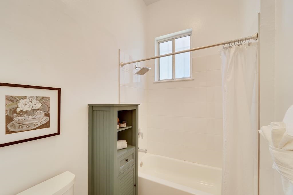 1022 Chestnut Street Oakland, CA 94607 - Photo 17 of 60 a bathroom with a shower and a bath tub