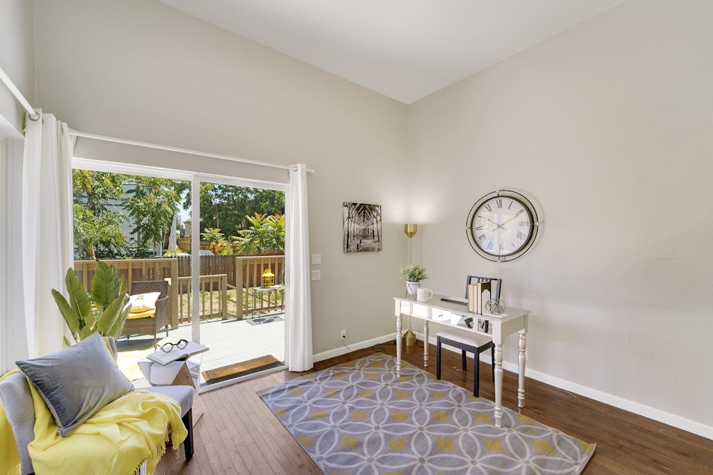 1022 Chestnut Street Oakland, CA 94607 - Photo 18 of 60 a living room with furniture a rug and a large window