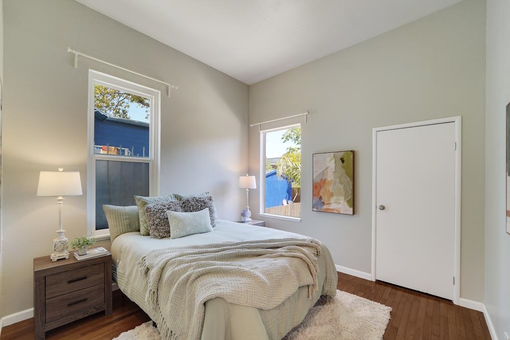 1022 Chestnut Street Oakland, CA 94607 - Photo 21 of 60 a bedroom with a bed and a painting on the wall