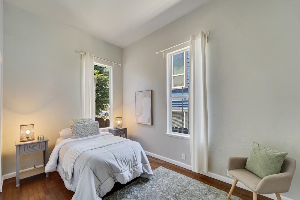 1022 Chestnut Street Oakland, CA 94607 - Photo 25 of 60 a bedroom with a bed and a chair