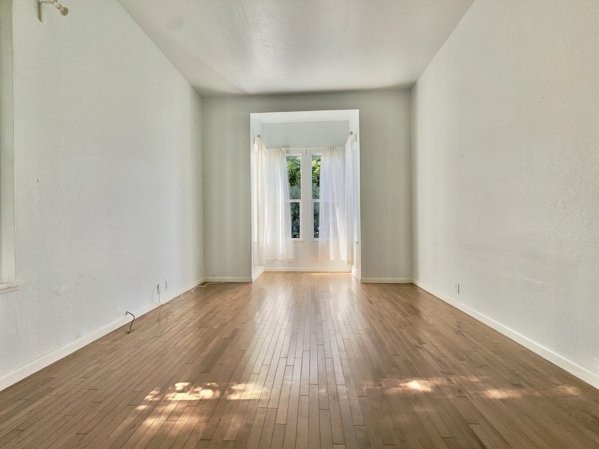 1022 Chestnut Street Oakland, CA 94607 - Photo 43 of 60 Empty room with hardwood / wood-style floors and french doors