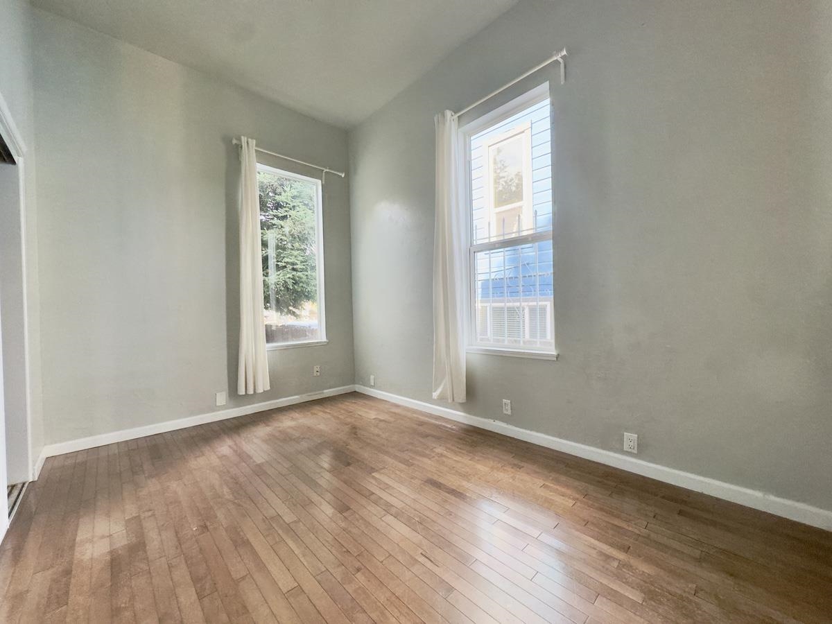 1022 Chestnut Street Oakland, CA 94607 - Photo 47 of 60 Unfurnished room featuring wood-type flooring and baseboards