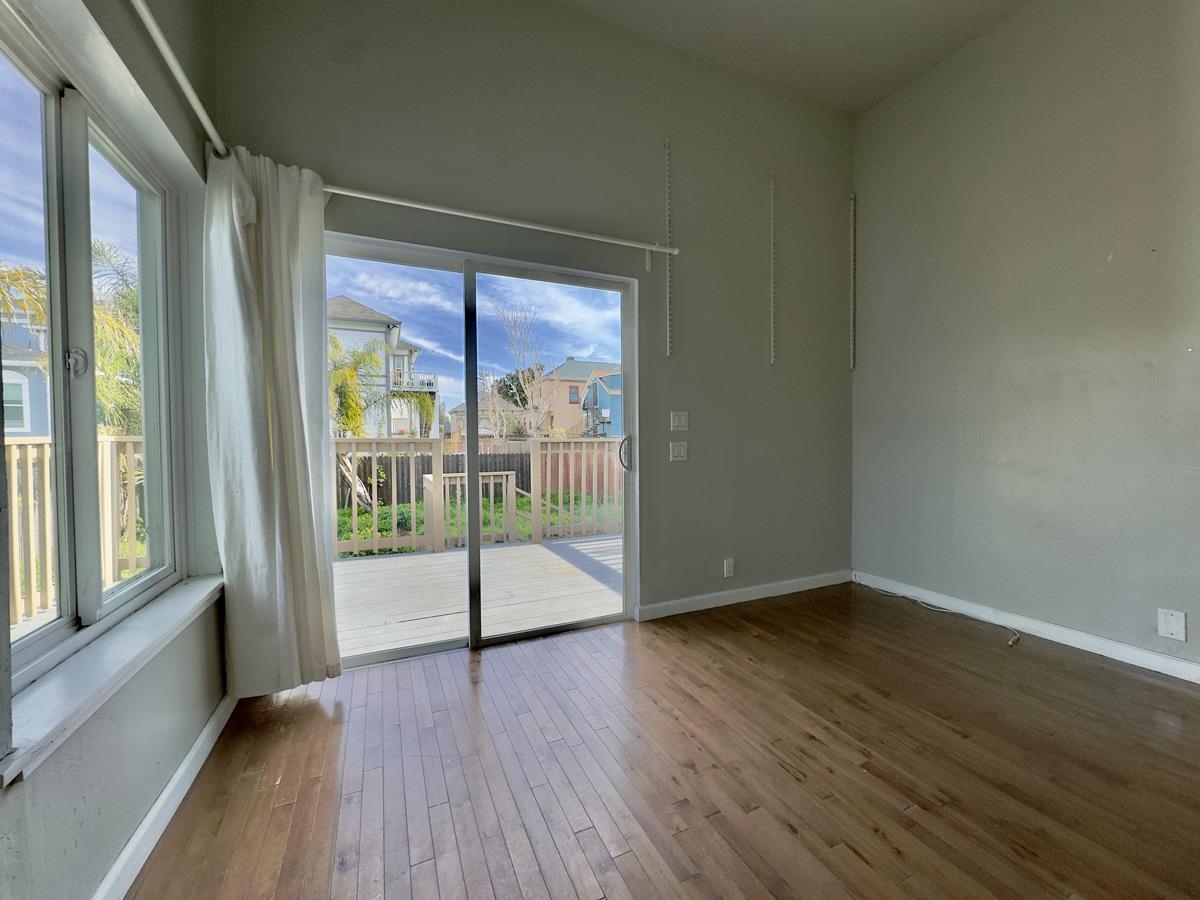 1022 Chestnut Street Oakland, CA 94607 - Photo 48 of 60 Spare room with baseboards and hardwood / wood-style floors