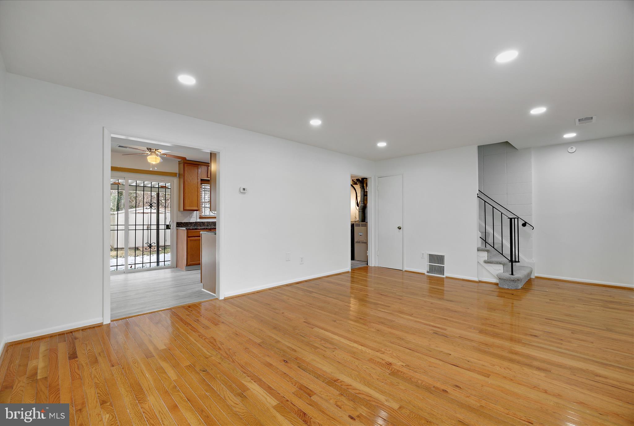 5600 Walker Mill Road Capitol Heights, MD 20743 - Photo 4 of 30 a view of an empty room with wooden floor and a window
