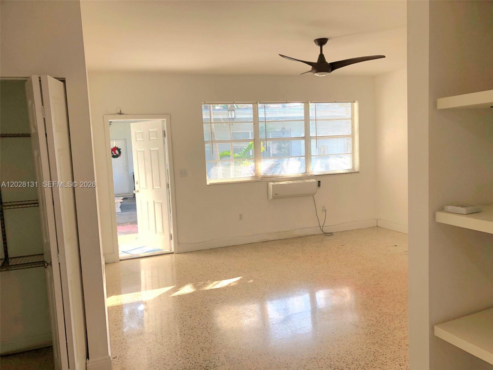 7135 Rue Granville, Unit 4 Miami Beach, FL 33141 - Photo 6 of 9 a view of an empty room with a window