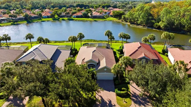 an aerial view of house with yard swimming pool and outdoor seating