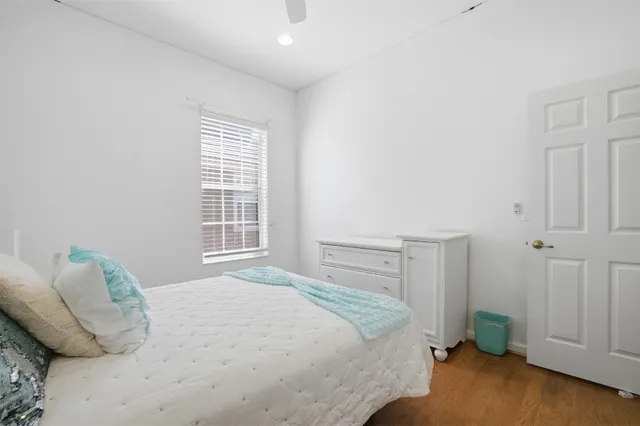 a view of a livingroom with an empty space and a ceiling fan