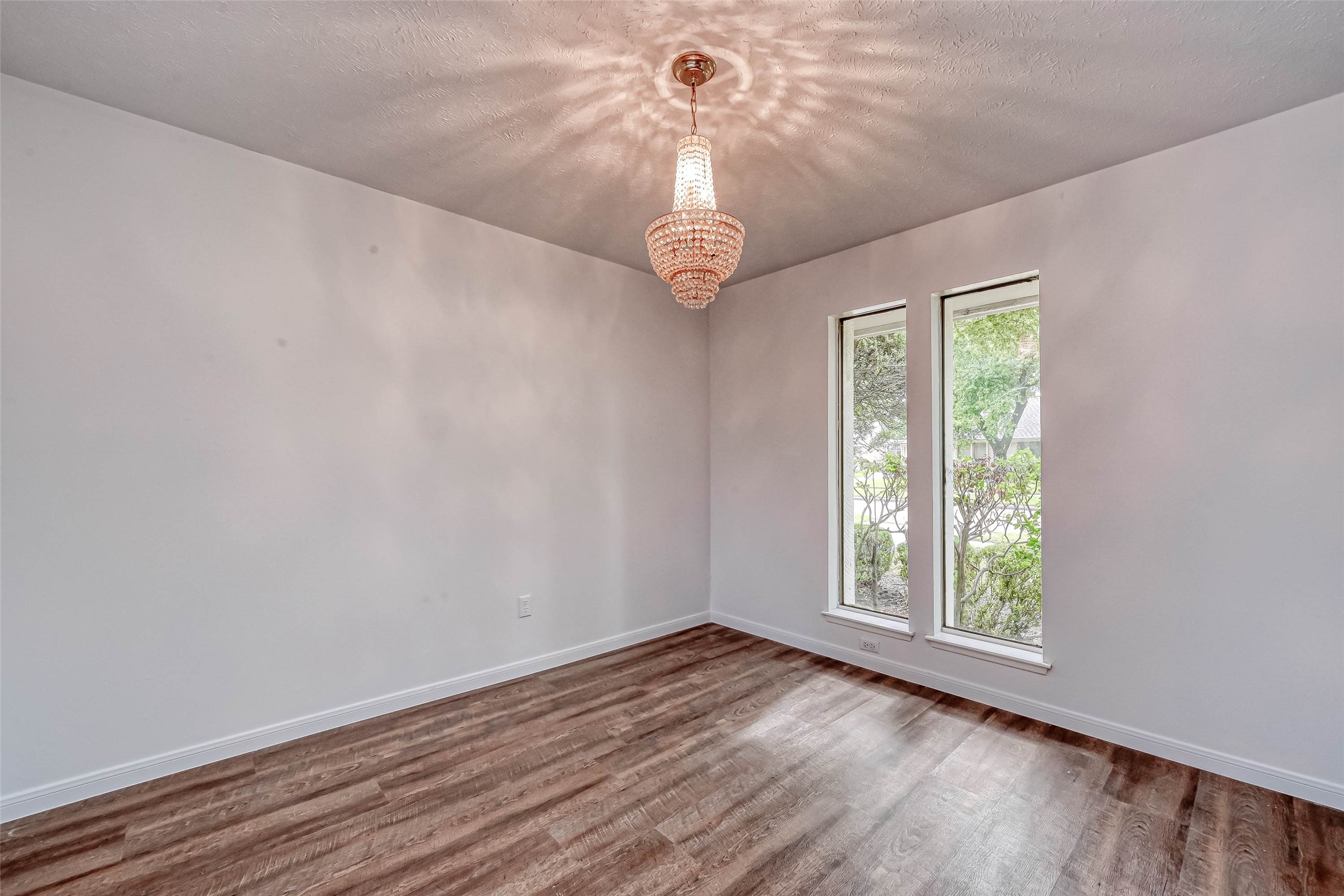 2831 Pecan Ridge Drive Sugar Land, TX 77479 - Photo 11 of 44 a view of an empty room with wooden floor and a window