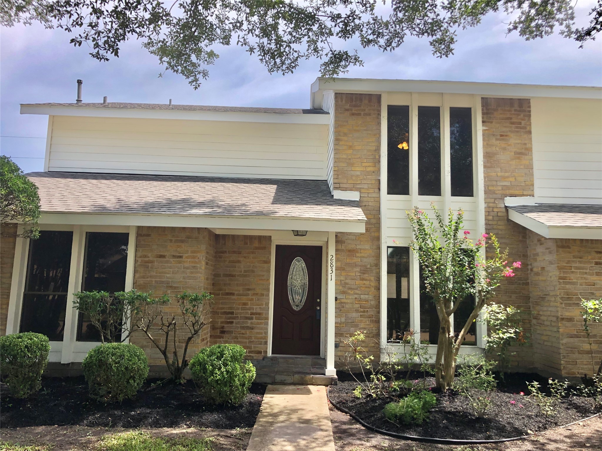 2831 Pecan Ridge Drive Sugar Land, TX 77479 - Photo 2 of 44 a front view of a house with plants