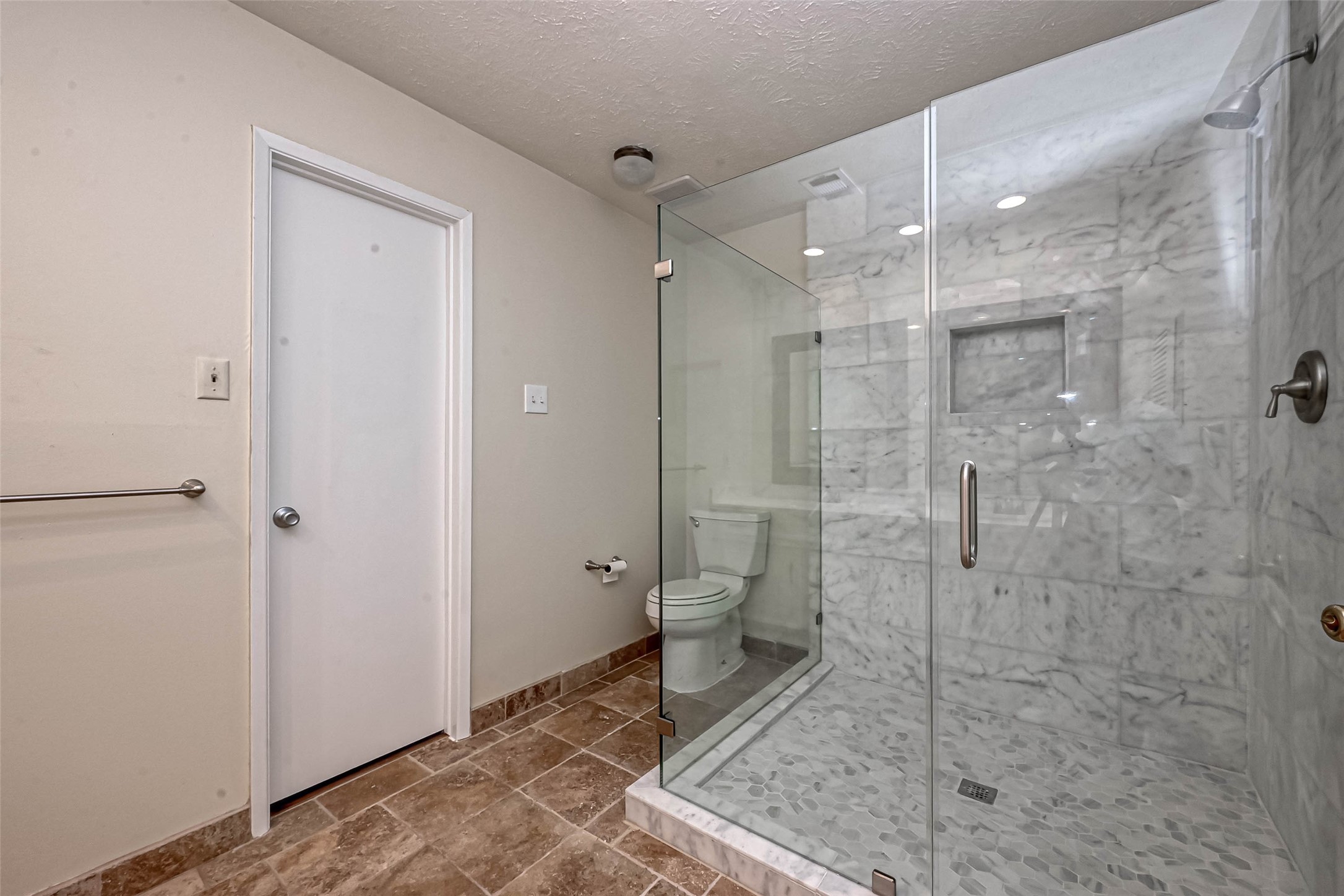 2831 Pecan Ridge Drive Sugar Land, TX 77479 - Photo 28 of 44 a bathroom with a shower and a toilet