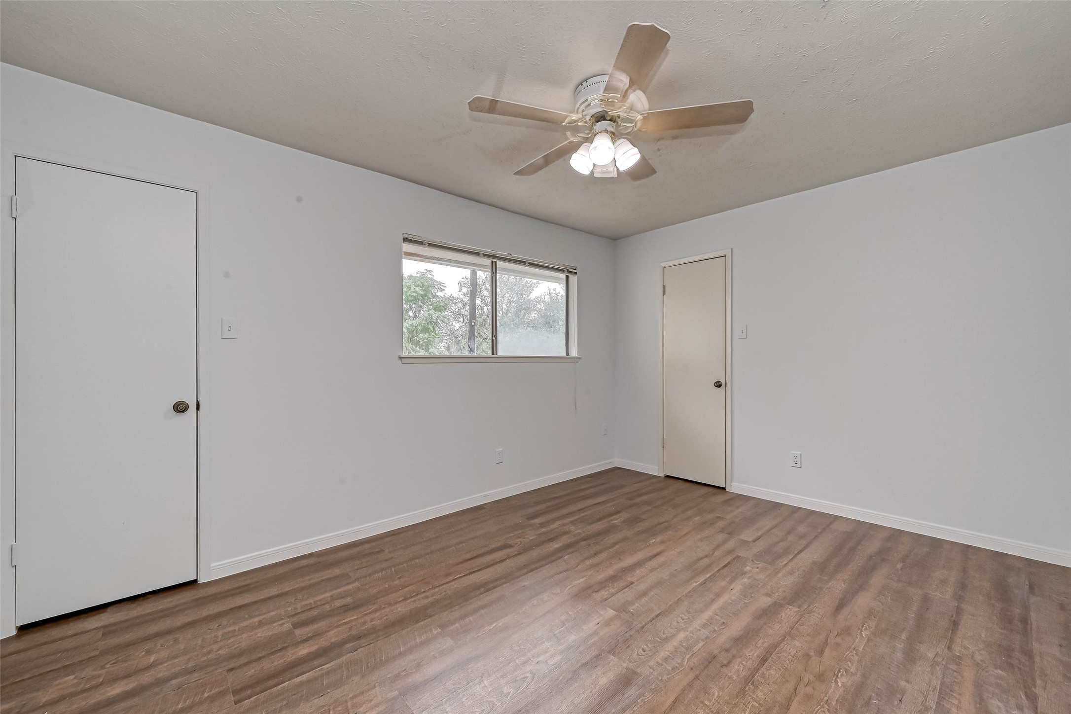 2831 Pecan Ridge Drive Sugar Land, TX 77479 - Photo 35 of 44 a view of an empty room with wooden floor and a window