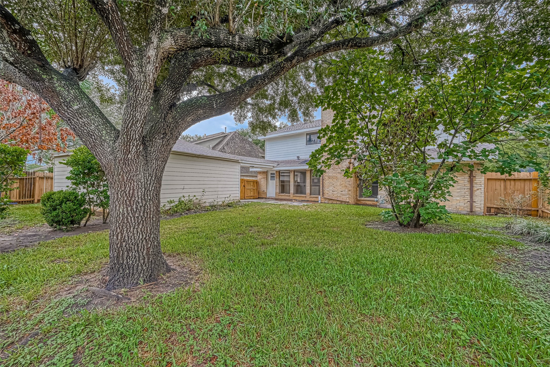 2831 Pecan Ridge Drive Sugar Land, TX 77479 - Photo 42 of 44 a view of a yard in front of a house with a large tree