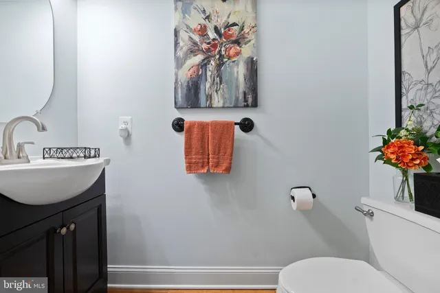 a spacious bedroom with a bed and a chandelier