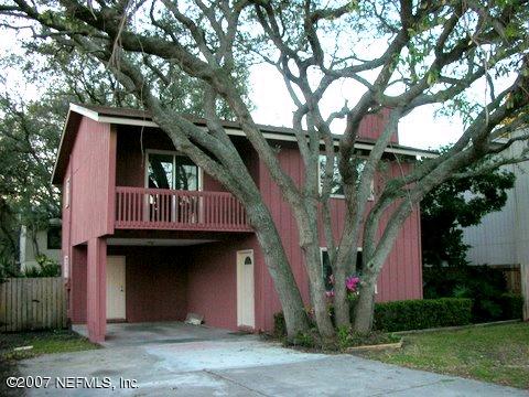 1150 Penman Road Jacksonville Beach, FL 32250 - Photo 1 of 16 a front view of a house with garden