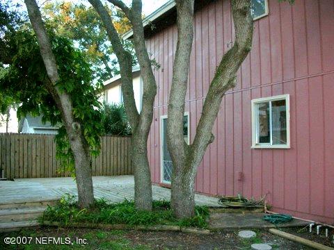1150 Penman Road Jacksonville Beach, FL 32250 - Photo 2 of 16 a front view of a house with garden