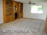 1150 Penman Road Jacksonville Beach, FL 32250 - Photo 10 of 16 wooden floor in a hall with a window