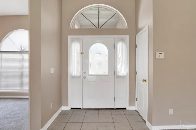 a view of a livingroom with wooden floor and a window