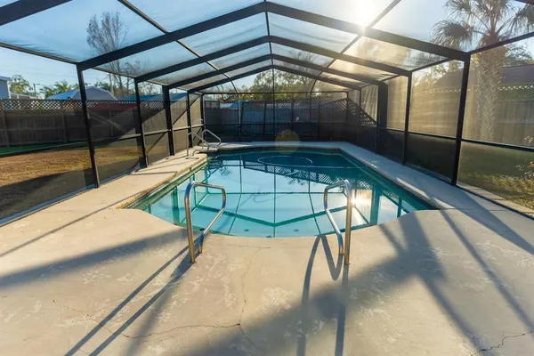 a view of a balcony with a table and chairs