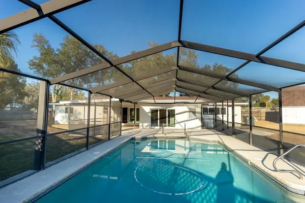 a view of a swimming pool with a patio