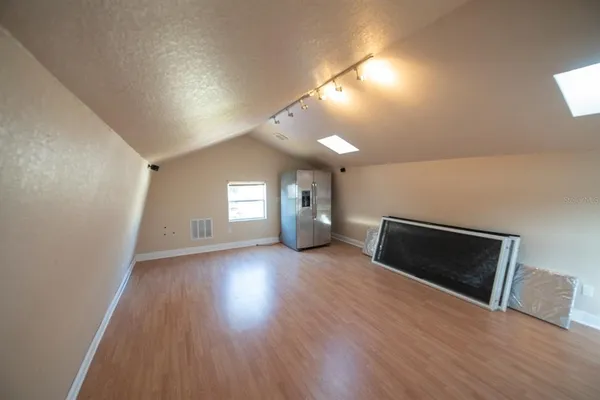 a view of a livingroom with wooden floor