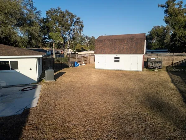 a view of a parking space in front of a house