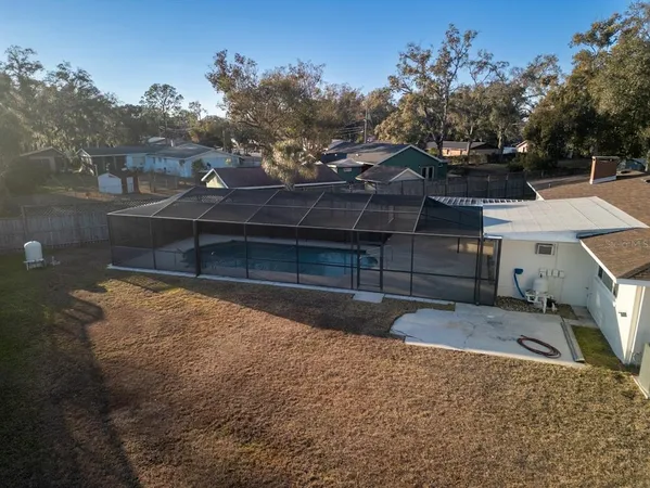 a view of a house with a backyard