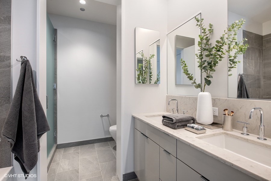 Undisclosed Address Chicago, IL 60610 - Photo 12 of 13 a bathroom with a sink and a mirror