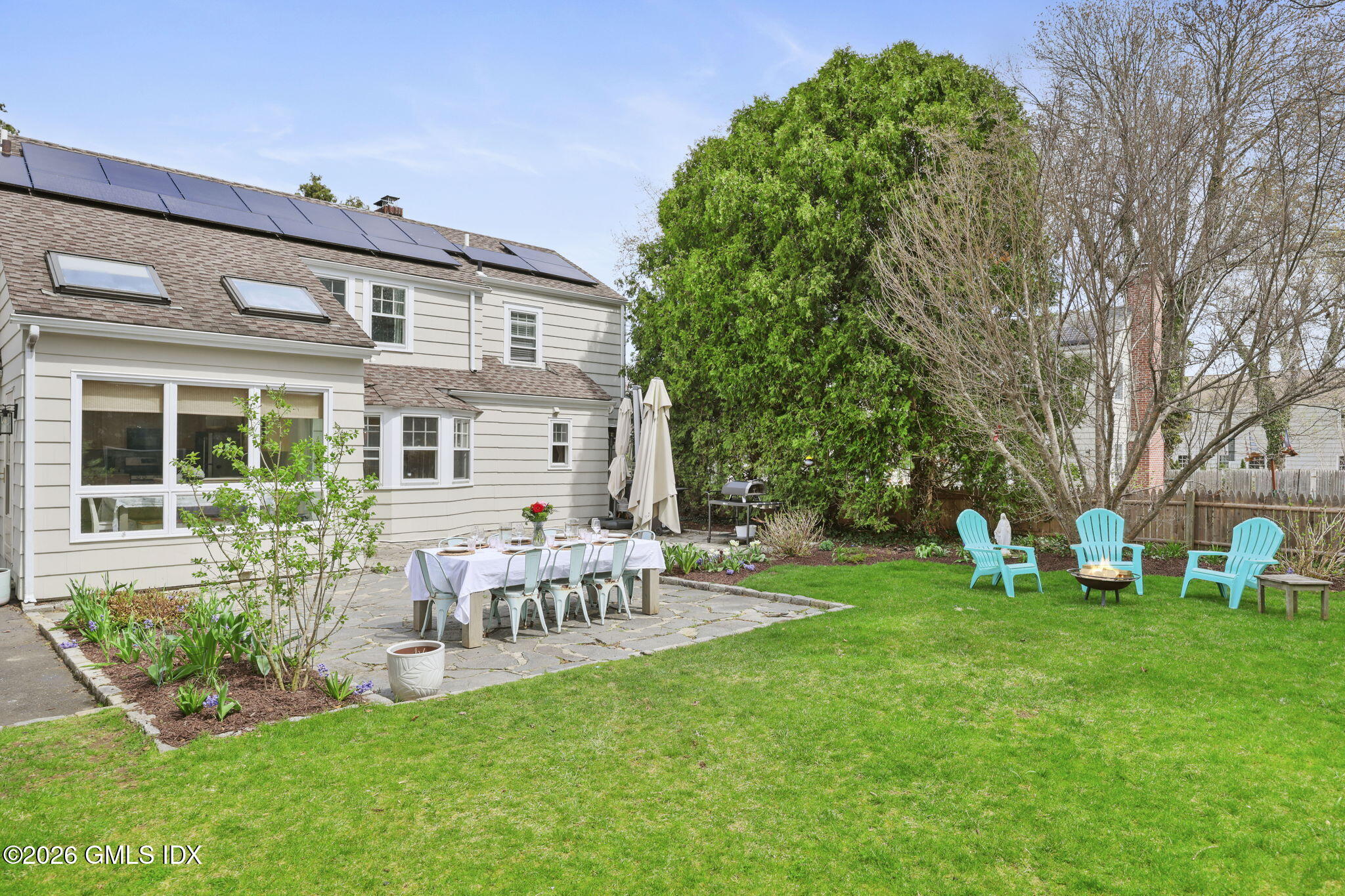 64 Summit Road Riverside, CT 06878 - Photo 31 of 34 a view of a house with backyard sitting area and garden
