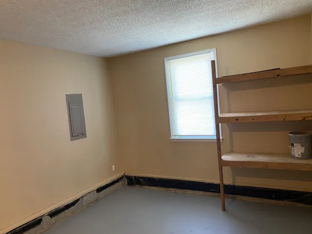 a front view of a house with a yard and a garage