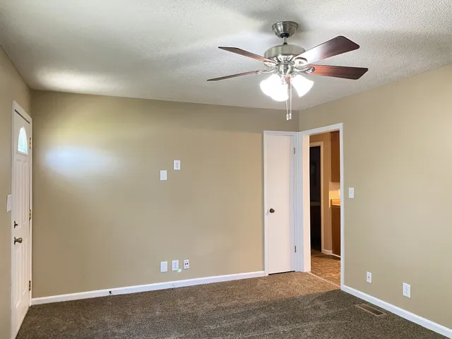 a kitchen with stainless steel appliances granite countertop a refrigerator a stove a sink and dishwasher