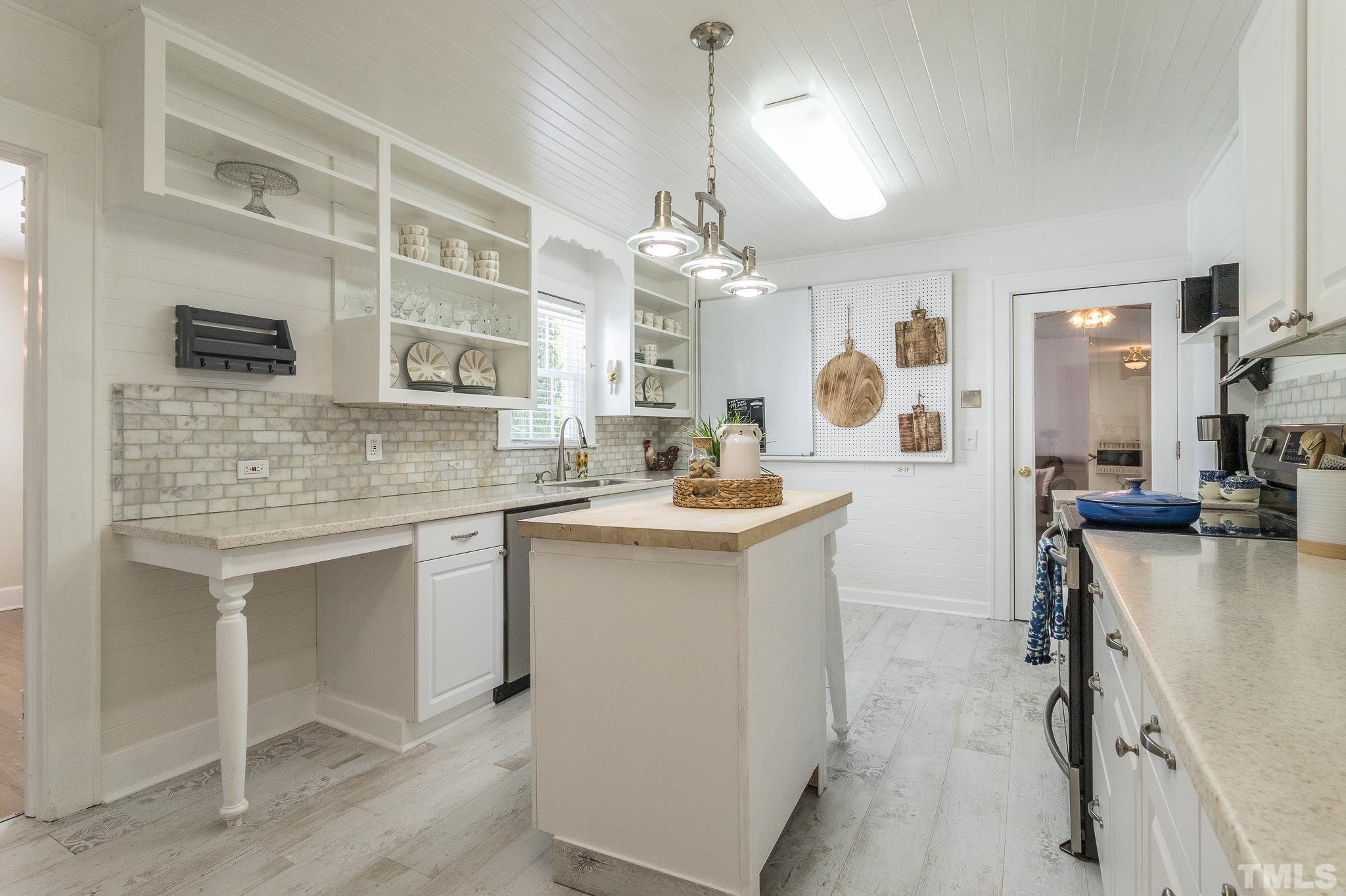 3620 Guess Road Durham, NC 27705 - Photo 11 of 41 a kitchen with a sink cabinets and window