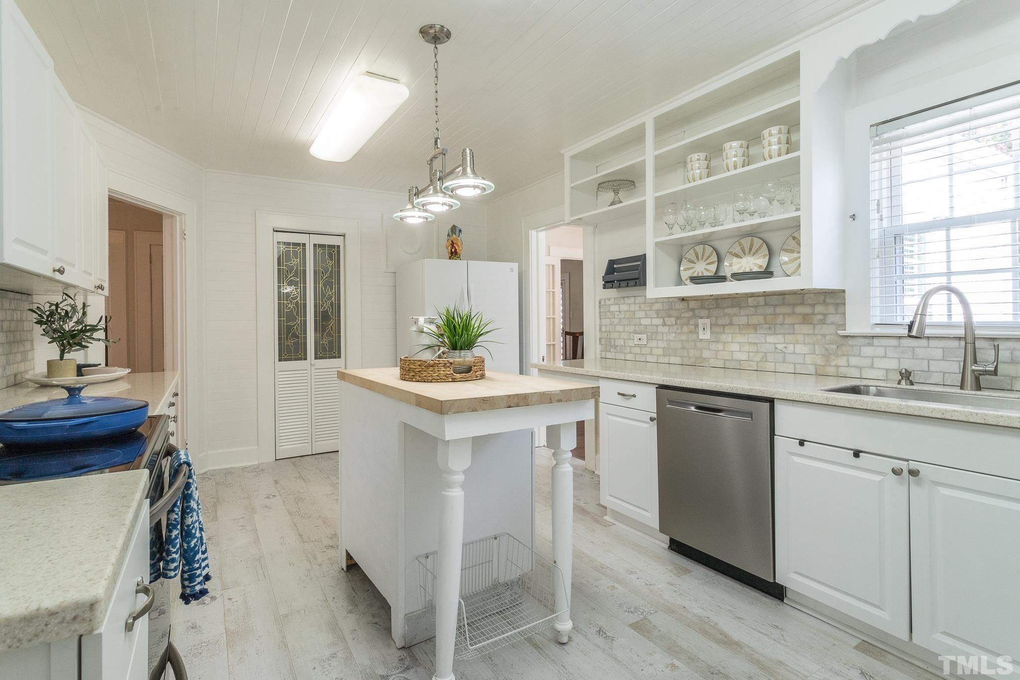 3620 Guess Road Durham, NC 27705 - Photo 12 of 41 a kitchen with a sink cabinets and window