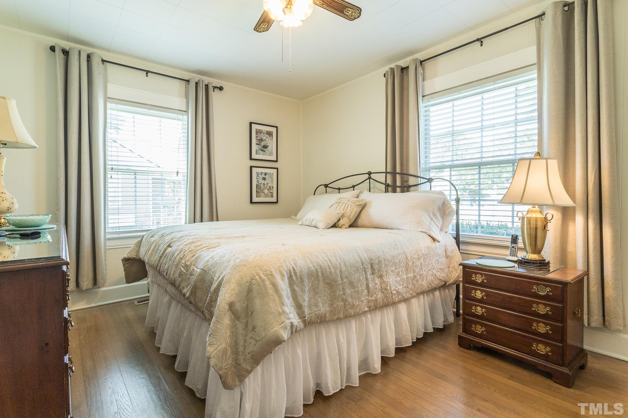 3620 Guess Road Durham, NC 27705 - Photo 18 of 41 a bedroom with a bed and a dresser next to a window
