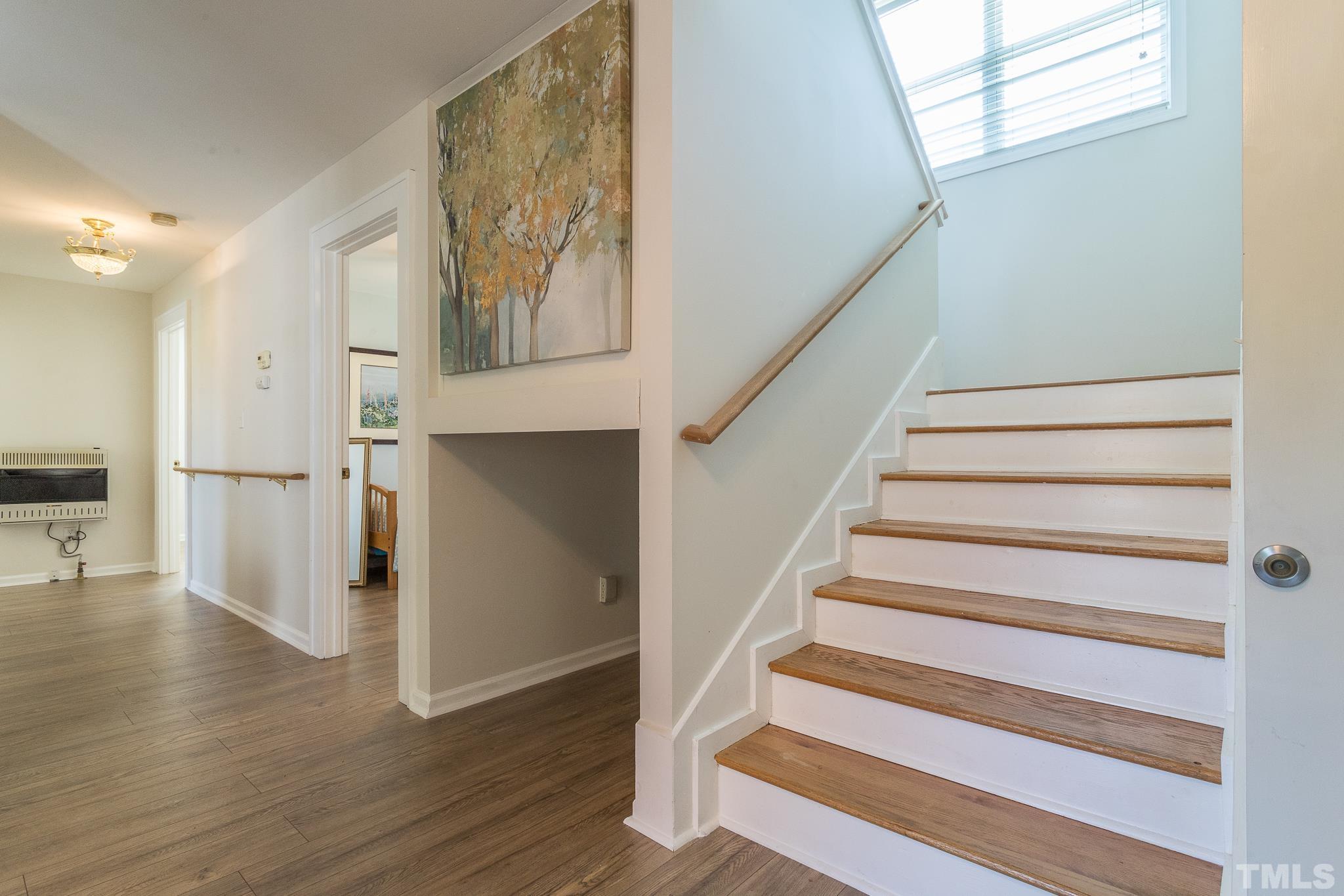 3620 Guess Road Durham, NC 27705 - Photo 24 of 41 a view of entryway with wooden floor and stairs