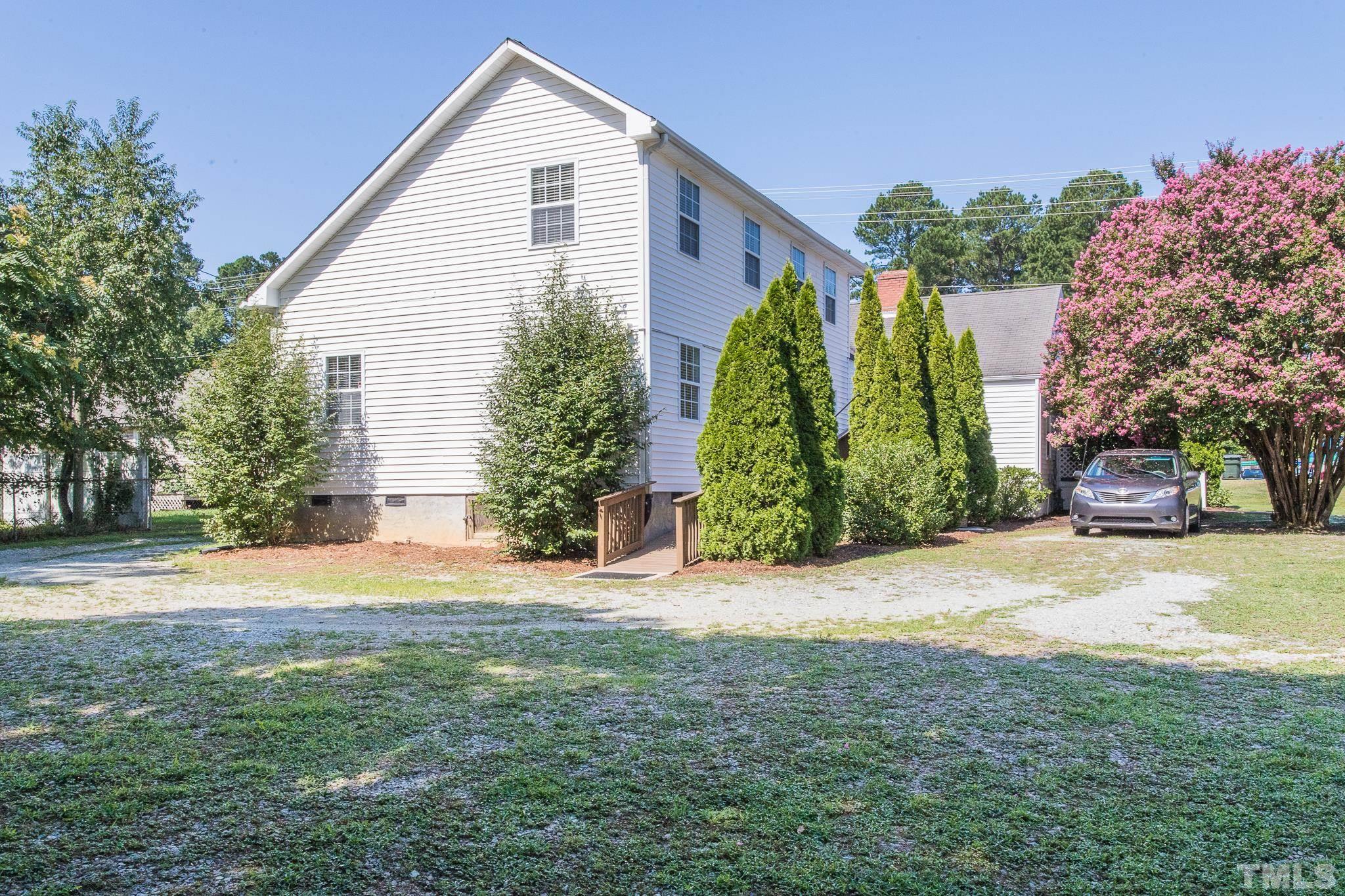 3620 Guess Road Durham, NC 27705 - Photo 33 of 41 a front view of a house with a garden