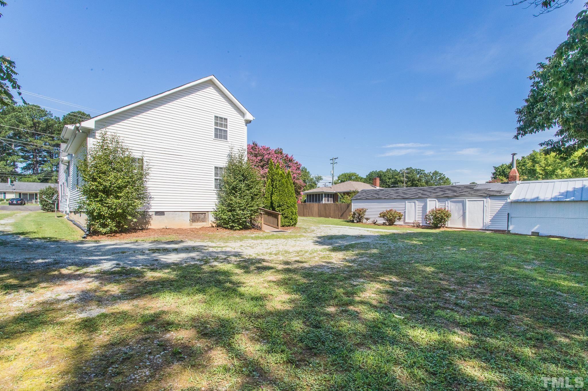 3620 Guess Road Durham, NC 27705 - Photo 35 of 41 a front view of house with yard and trees in the background