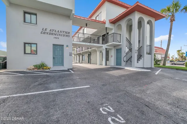 a front view of a house with a street