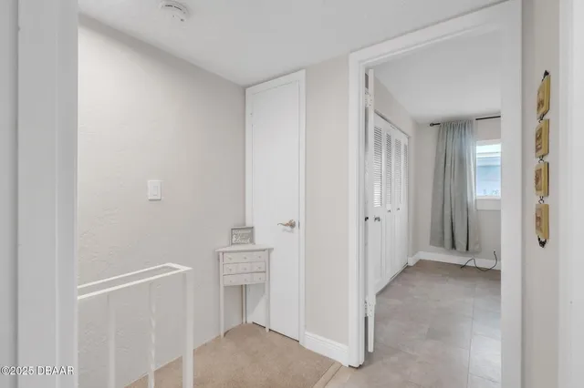 a view of a hallway with closet