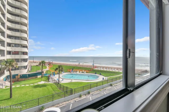 a view of swimming pool from a balcony