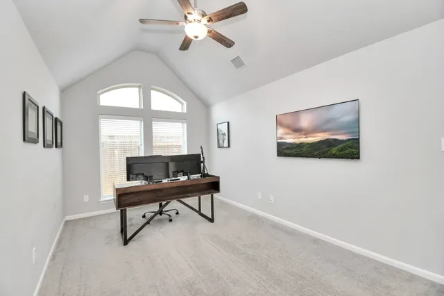 a view of a livingroom with furniture and a window