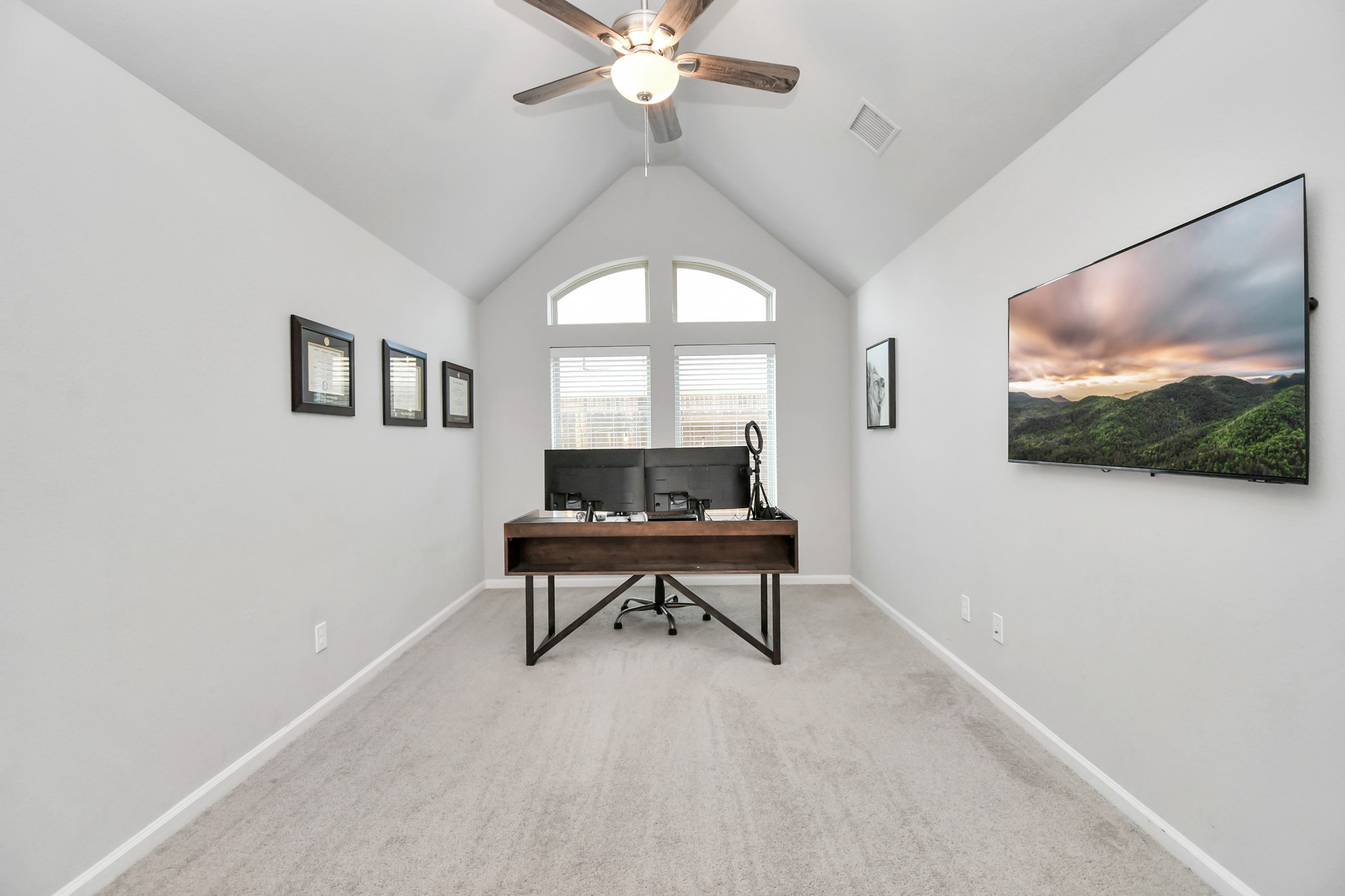 10522 Rigel Rdg Way Richmond, TX 77406 - Photo 29 of 41 a living room with furniture a rug and a flat screen tv