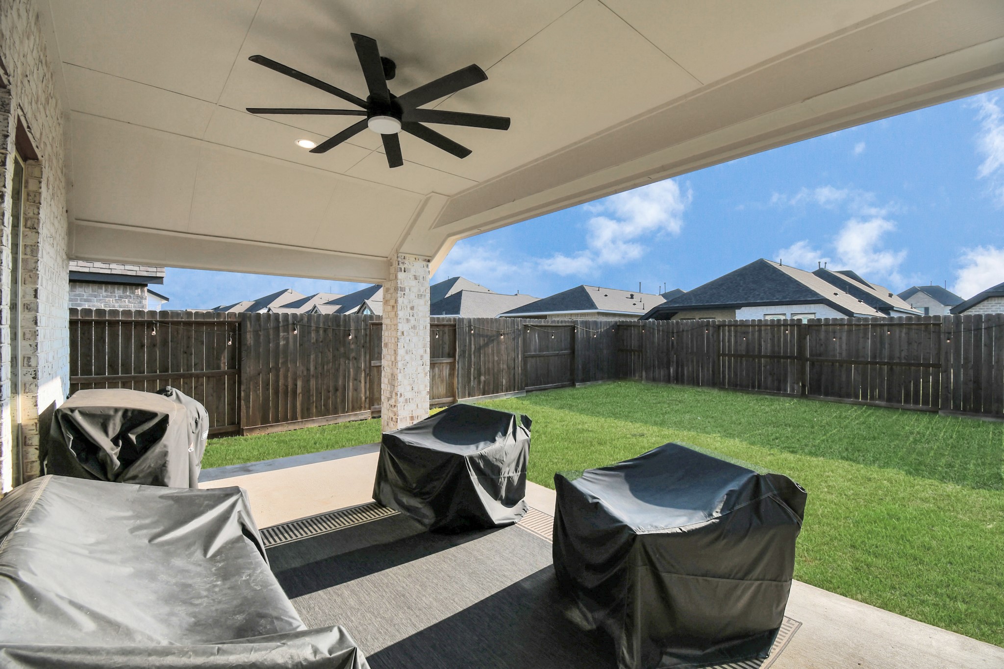10522 Rigel Rdg Way Richmond, TX 77406 - Photo 32 of 41 a view of a patio with a yard